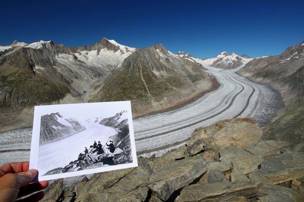 A handout picture of the Aletsch Glacier in Fieschertal, Switzerland taken between 1860 and 1890 and released by Library of Congress, is displayed at the same location on September 4, 2019. Picture taken September 4, 2019. REUTERS/Denis Balibouse and Library of Congress/Handout via REUTERS THIS IMAGE HAS BEEN SUPPLIED BY A THIRD PARTY. TPX IMAGES OF THE DAY - RC29ID9HB2R9