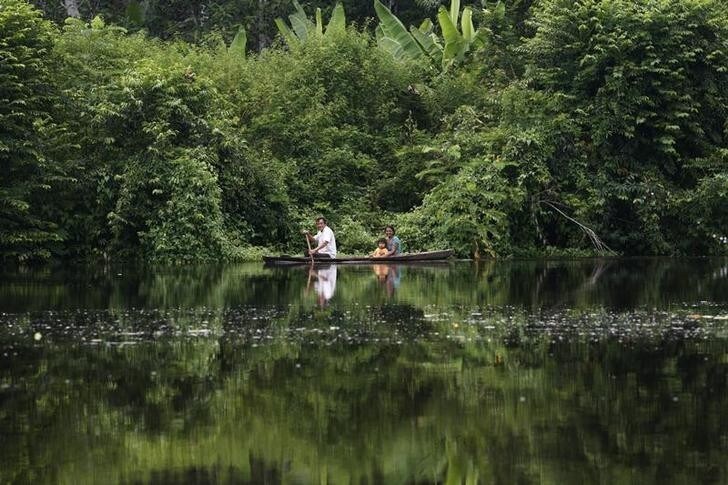 A family travels by canoe on the Maranon river in the Pacaya Samiria National Reserve in the Amazon jungle March 28, 2008. The Pacaya Samiria National Reserve is located in Peru's Amazon region, 93 miles (150 km) from Iquitos city. The reserve is the largest in Peru and the second largest in the Amazon region. The great size of the reserve assures that it will be ecologically and genetically representative of the region, with an abundance of virtually unchanged areas. Approximately 47,000 people live in the reserve and are located mainly along its edges in villages. Picture taken March 28, 2008. REUTERS/Mariana Bazo (PERU)