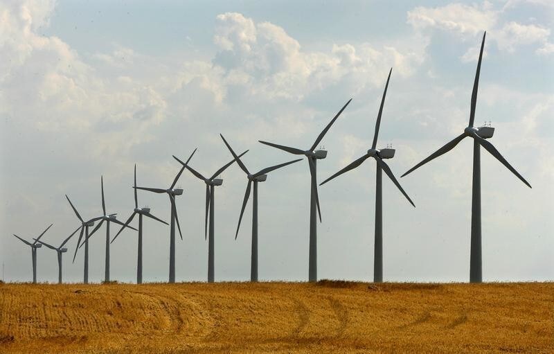 Giant wind turbines are seen in a dry field at Los Monegros in Aragon, Spain July 1, 2005. A severe drought in Spain, the worst since the 1970s, has sparked forest fires and is threatening millions of tourists with water rationing as they head for the beaches this summer. NTRES REUTERS/Albert Gea AG/GN/CN - RP6DRNASZOAB