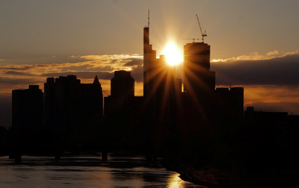 The skyline of the banking district is seen during sunset in Frankfurt, Germany, April 21, 2024. The European finance sector must begin preparing for the age of quantum computing — and in this effort collaboration is essential.