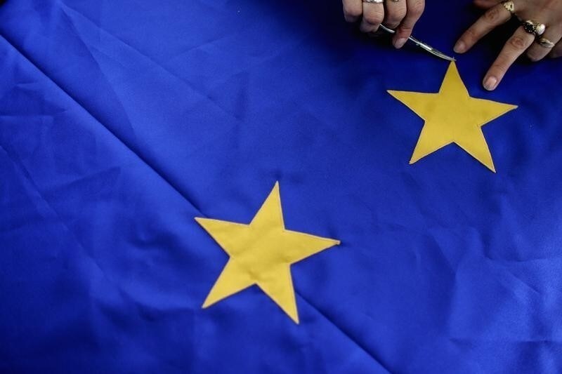 A Bulgarian seamstress manufactures EU flags in a factory in the town of Parvomai, some 160 km (99 miles) south east of the capital Sofia, December 13, 2006. Bulgaria is set to join the EU on January 1, 2007 along with its neighbour Romania. REUTERS/Stoyan Nenov (BULGARIA) - RTR1KCT7