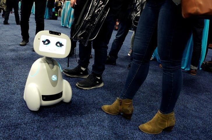 A Buddy robot by Blue Frog roams the floor during the opening event at CES in Las Vegas, Nevada, U.S. January 7, 2018. REUTERS/Rick Wilking