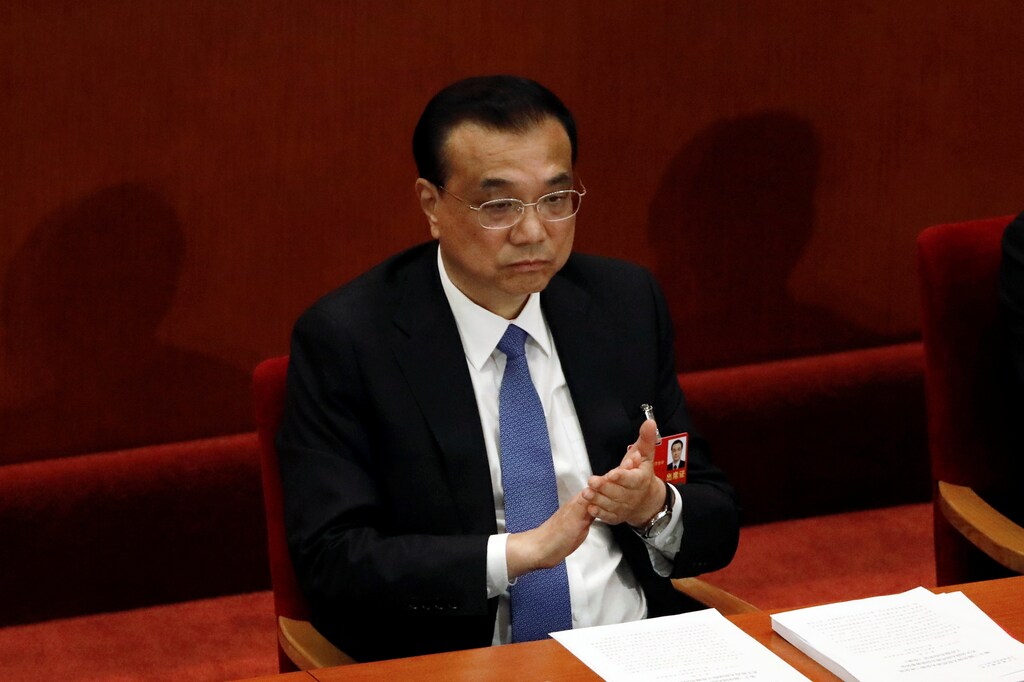 Chinese Premier Li Keqiang attends the closing session of the National People's Congress (NPC) at the Great Hall of the People in Beijing, China May 28, 2020. REUTERS/Carlos Garcia Rawlins - RC2LXG93Q12T