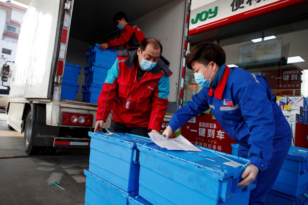 Workers unload groceries at a Sinopec gas station where customers can buy supplies while they refuel as the country is hit by an outbreak of the novel coronavirus, in Beijing, Coronavirus china virus health healthcare who world health organization disease deaths pandemic epidemic worries concerns Health virus contagious contagion viruses diseases disease lab laboratory doctor health dr nurse medical medicine drugs vaccines vaccinations inoculations technology testing test medicinal biotechnology biotech biology chemistry physics microscope research influenza flu cold common cold bug risk symptomes respiratory china iran italy europe asia america south america north washing hands wash hands coughs sneezes spread spreading precaution precautions health warning covid 19 cov SARS 2019ncov wuhan sarscow wuhanpneumonia pneumonia outbreak patients unhealthy fatality mortality elderly old elder age serious death deathly deadly