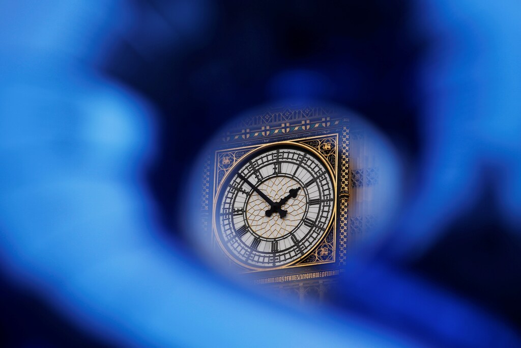 The Big Ben bell tower on the Houses of Parliament is visible through a shaped foil balloon as demonstrators protest during a "March for Europe" against the Brexit vote result earlier in the year, in London, Britain, September 3, 2016.