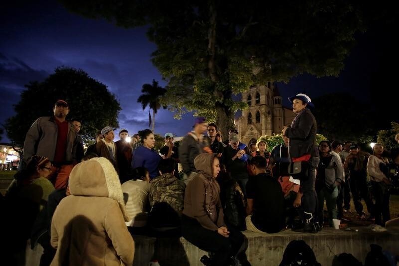 An activist gives instructions for Nicaraguan refugees fleeing their country due to unrest before taking them to sleep in a Christian church in San Jose, Costa Rica July 28, 2018. Picture taken July 28, 2018.