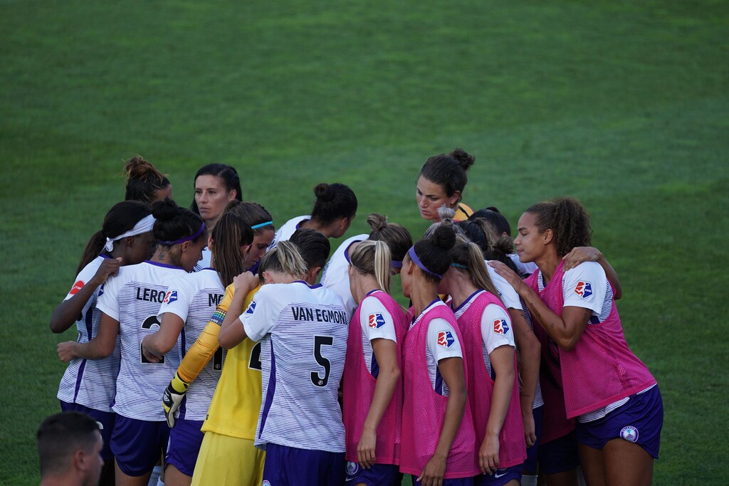 Sports team huddle.
