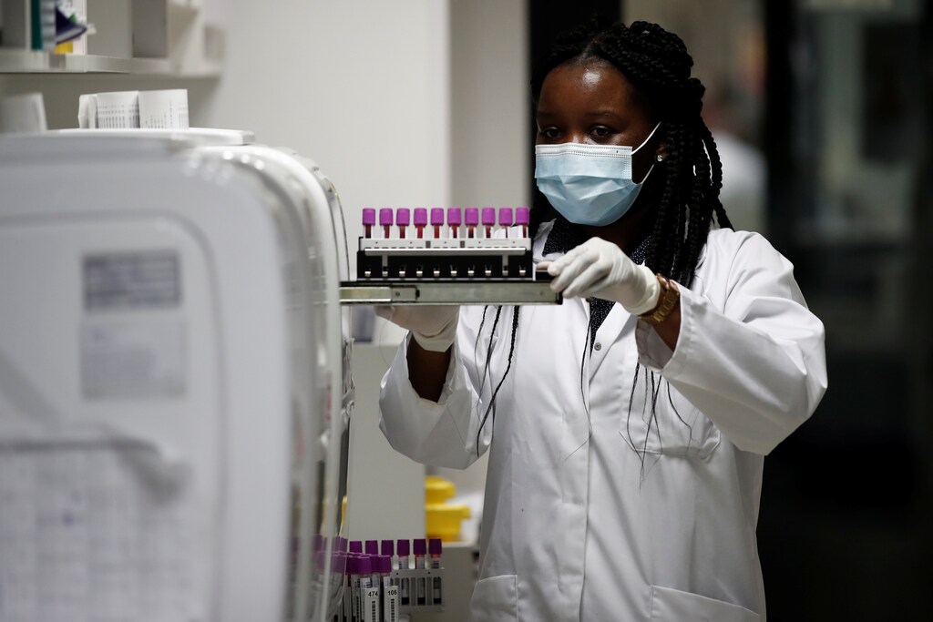 A staff member works on coronavirus serology tests at the Biogroup-LCD laboratory's technical platform in Levallois-Perret, near Paris after France began a gradual end to a nationwide lockdown due to the coronavirus disease (COVID-19) outbreak, France, May 18, 2020. REUTERS/Benoit Tessier - RC23RG9HL39I