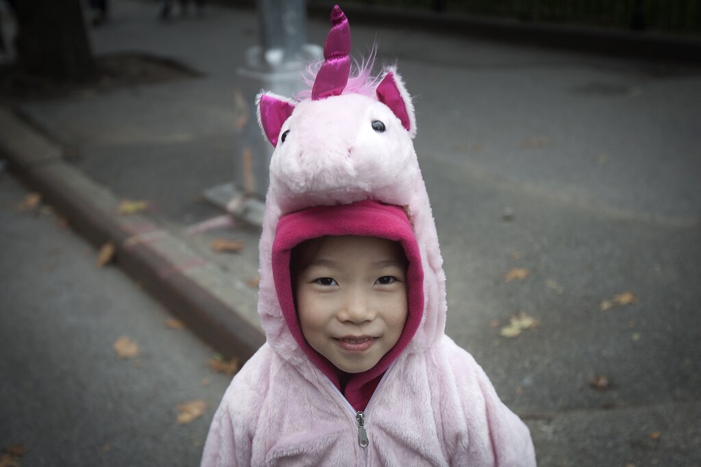 A child in a unicorn costume takes part in the 24th Annual Greenwich Village Children's Halloween Parade in the Manhattan borough of New York October 31, 2014. REUTERS/Carlo Allegri (UNITED STATES - Tags: SOCIETY) - GM1EAB10F7W01