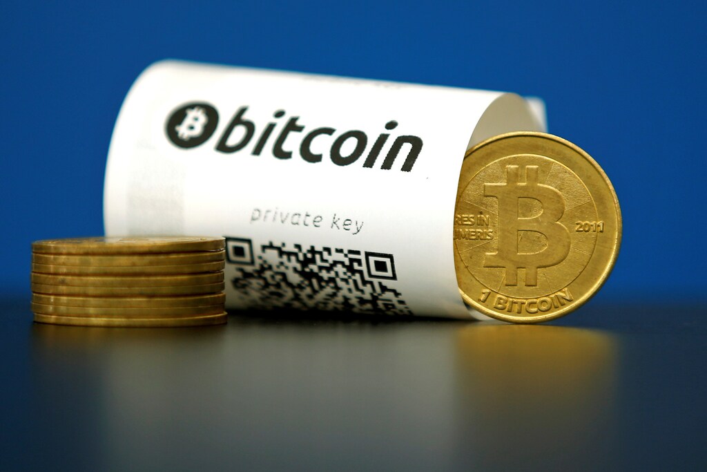 A Bitcoin (virtual currency) paper wallet with QR codes and a coin are seen in an illustration picture taken at La Maison du Bitcoin in Paris, France, May 27, 2015.