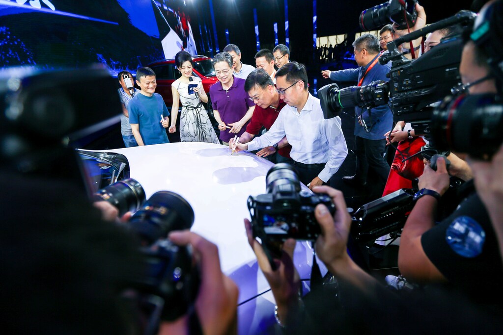 Jack Ma (L), Alibaba's founder and chairman, and other company leaders attend the launch event of a internet-connected car in Hangzhou, Zhejiang province, July 6, 2016. China Daily/via REUTERS ATTENTION EDITORS - THIS PICTURE WAS PROVIDED BY A THIRD PARTY. EDITORIAL USE ONLY. CHINA OUT. NO COMMERCIAL OR EDITORIAL SALES IN CHINA. - RTX2JYXW