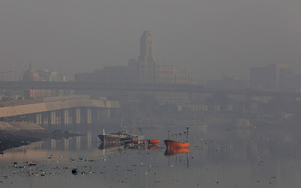 A general view of boats amid dense fog and mist in the background during morning hours at China Creek area in Karachi, Pakistan January 17, 2020. REUTERS/Akhtar Soomro - RC2JHE9XUAJG