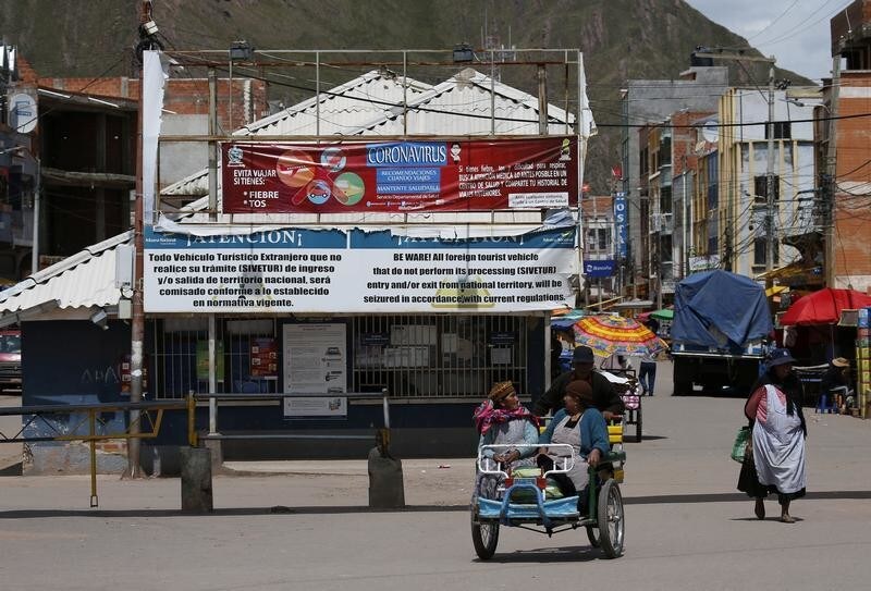A view of Desaguadero town, on the Bolivian side of the border with Peru, after Peru's government announcement of border closure caused by coronavirus diseases (COVID-19), Bolivia, March 17, 2020. The banner at the top illustrates the steps people can take to prevent the spread of the coronavirus. REUTERS/David Mercado - RC2ZLF9OLH7B