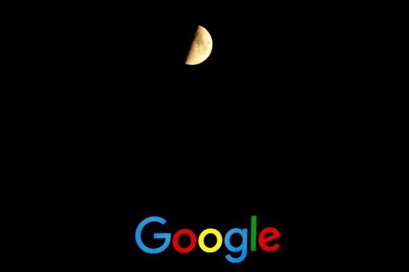 The waxing moon is seen over the logo of Google at its European Engineering Center in Zurich, Switzerland July 19, 2018.