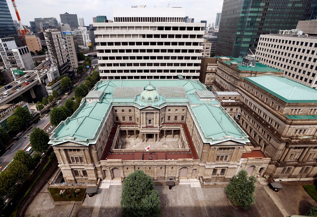 Japanese national flag is hoisted atop the headquarters of Bank of Japan in Tokyo, Japan September 20, 2023. REUTERS/Issei Kato