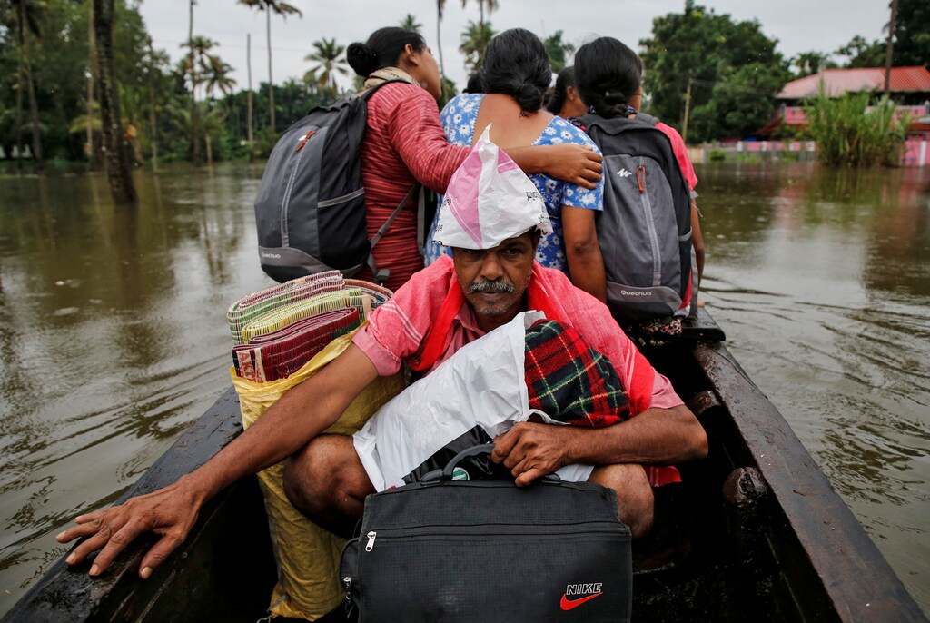 Flood-affected people are moved to a safer place in Paravur in Ernakulam district in the southern state of Kerala, India, August 9, 2019. REUTERS/Sivaram V - RC179A3CB5D0