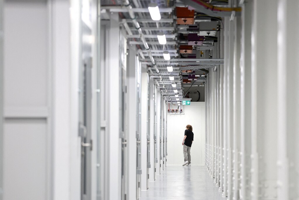 An IT technician walks inside the Nebius AI UK data centre, a new facility hosting NVIDIA and other computer firms, at Ark Data Centres, in Chertsey, Britain, November 6, 2025: AI is hitting a memory wall