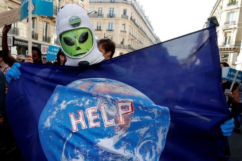 Protesters march to urge politicians to act against climate change, in Paris, France, October 13, 2018.