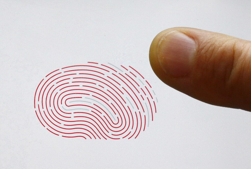 A person uses a sensor for biometric identification on a smartphone in Berlin, Germany October 16, 2015. On the verge of collapse a decade ago, Sweden's Fingerprint Cards (FPC) has emerged market leader in a booming industry set to supply billions of touch fingerprint sensors for smartphones, tablets and credit cards in the years ahead. After years in the wildnerness, plowing cash into product development, the main rival of U.S. Synaptics has seen demand soar in 2015, bagging deals from some of China's biggest smartphone makers and U.S. tech giant Google. REUTERS/Fabrizio Bensch - LR1EBAG0VJL09