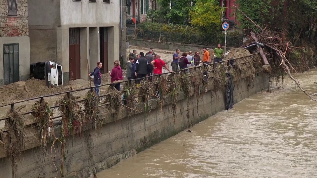 Local residents clean up after flash floods in Castelletto D'Orba, Italy, October 22, 2019. Local Team/REUTERS TV via REUTERS ATTENTION EDITORS - ITALY OUT. NO COMMERCIAL OR EDITORIAL SALES IN ITALY AND .IT WEBSITES. THIS IMAGE HAS BEEN SUPPLIED BY A THIRD PARTY. - RC1E326EB0C0