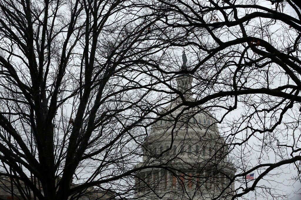 A rainy, gray sky tops the U.S. Capitol dome on the first day of the new session of Congress in Washington, U.S. January 3, 2017. REUTERS/Jonathan Ernst - RTX2XDIV