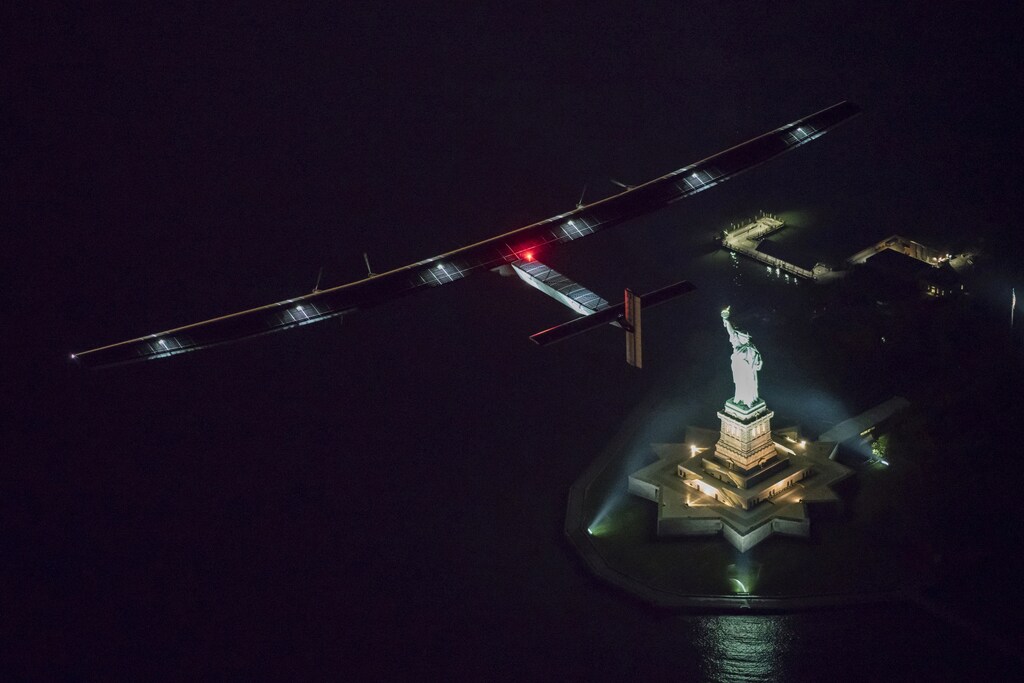 Solar Impulse 2, the solar airplane, piloted by Swiss adventurer Andre Borschberg, flies over the Statue of Libery in in New York, U.S., June 11, 2016 shortly before landing at John F. Kennedy airport. Leg 14 was the shortest so far on the planes trip around the globe.