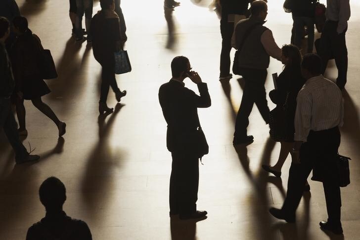 A man stands in the middle of Grand Central Terminal as he speaks on a cell phone, as passengers face limited train service on the New Haven Line between Stamford Station and Grand Central Terminal due to a Con Edison power problem in New York, September 25, 2013. REUTERS/Zoran Milich (UNITED STATES - Tags: TRANSPORT ENERGY TPX IMAGES OF THE DAY)