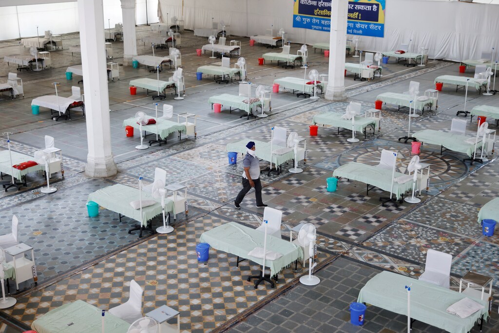Beds are seen inside a Gurudwara (Sikh Temple) converted into a coronavirus disease (COVID-19) care facility amidst the spread of the COVID-19 in New Delhi, India May 5, 2021. REUTERS/Adnan Abidi TPX IMAGES OF THE DAY - RC2J9N9GZ2PC