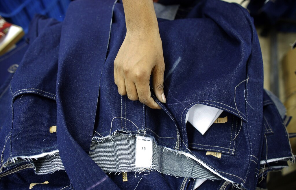 A stack of clothes is seen at a garment factory near the collapsed Rana Plaza building in Savar, Bangladesh June 16, 2013. The April 24 collapse of the Rana Plaza complex, built on swampy ground outside Dhaka with several illegal floors, killed 1,132 workers and focused international attention on sometimes lax safety standards in Bangladesh's booming garment industry. At least five different Bangladesh agencies have dispatched teams to start inspecting the country's thousands of garment factories, but there has been little coordination between them. More than four million people, mostly women, work in Bangladesh's clothing sector, which is the country's largest employment generator, with annual exports worth $21 billion. Picture taken June 16, 2013. REUTERS/Andrew Biraj (BANGLADESH - Tags: BUSINESS INDUSTRIAL EMPLOYMENT SOCIETY) ATTENTION EDITORS: PICTURE 03 OF 35 FOR PACKAGE 'INDUSTRY'S VICTIMS IN BANGLADESH'. TO FIND ALL IMAGES SEARCH 'INDUSTRY'S VICTIMS BIRAJ'
