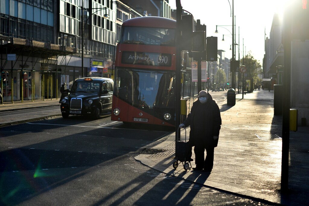 A man wearing a protective face mask in Oxford street during rush hour as the spread of the coronavirus disease.