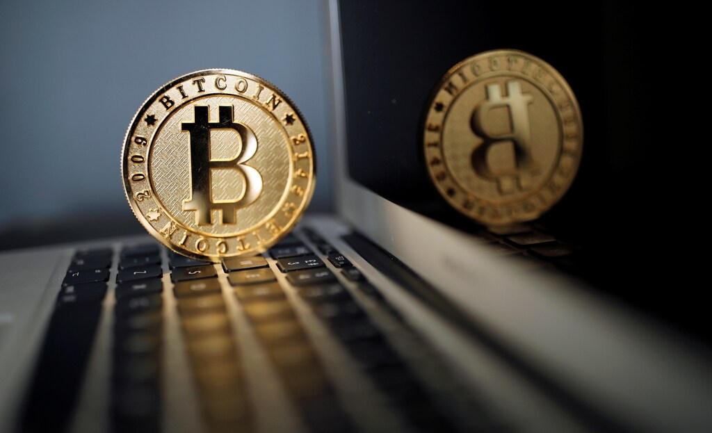 A Bitcoin (virtual currency) coin is seen in an illustration picture taken at La Maison du Bitcoin in Paris, France, June 23, 2017.