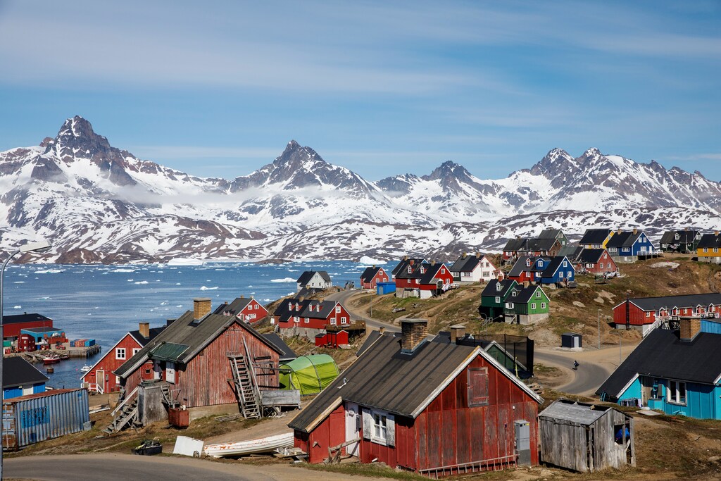 Snow covered mountains rise above the harbour and town of Tasiilaq, Greenland, June 15, 2018. REUTERS/Lucas Jackson SEARCH "JACKSON TASIILAQ" FOR THIS STORY. SEARCH "WIDER IMAGE" FOR ALL STORIES.