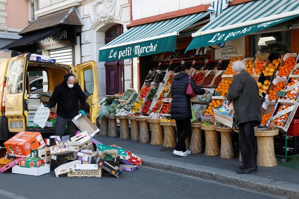 Local residents shop for fruit and vegetables at a mini market during the outbreak of Coronavirus disease (COVID-19) in Fontenay-sous-Bois, France, April 1, 2020.