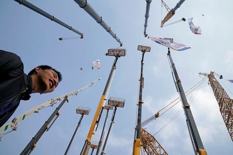 A man visits heavy machinery at Bauma China, the International Trade Fair for Construction Machinery in Shanghai, China November 27, 2018. Picture taken November 27, 2018. REUTERS/Aly Song - RC183B1B2780