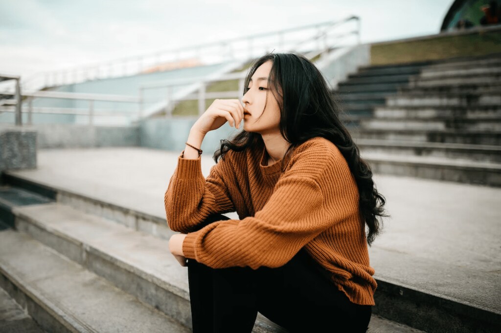 A person sitting down and thinking