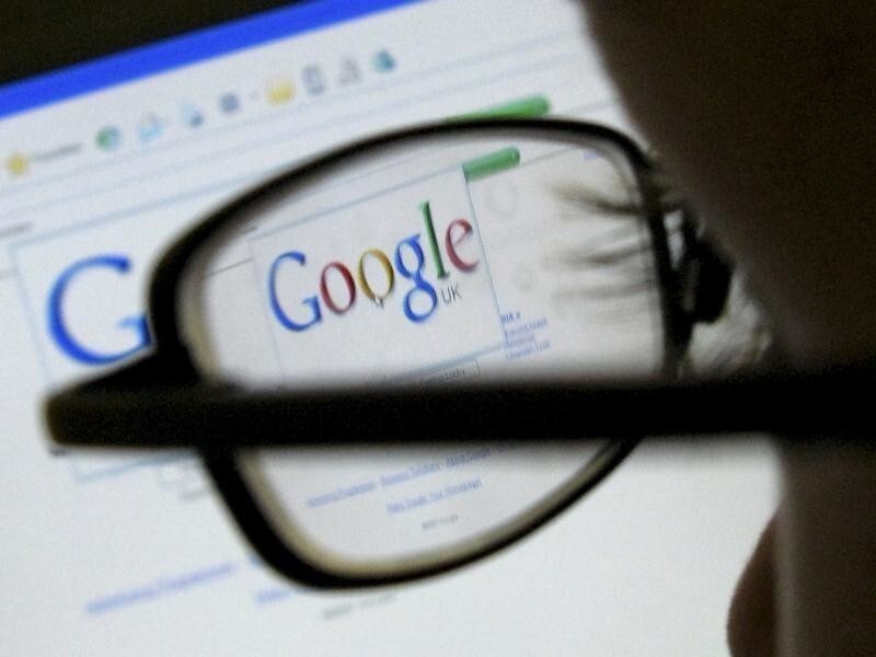 A Google search page is seen through the spectacles of a computer user in Leicester, central England July 20, 2007. Web search leader Google reported on Thursday a 28 percent rise in profits that fell short of consensus expectations, as a recent jump in operating expenses offset market share gains against rivals. This logo has been updated and is no longer in use. REUTERS/Darren Staples (BRITAIN) - LF3DVSZMFXAA