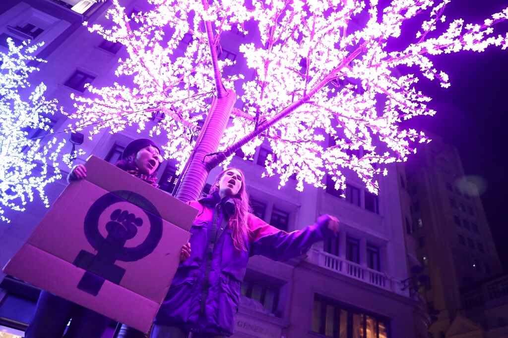 Demonstrators hold a placard during a protest to mark the annual International Day for the Elimination of Violence against Women in Madrid, Spain, November 25, 2019. REUTERS/Sergio Perez - RC2KID9UL2RB