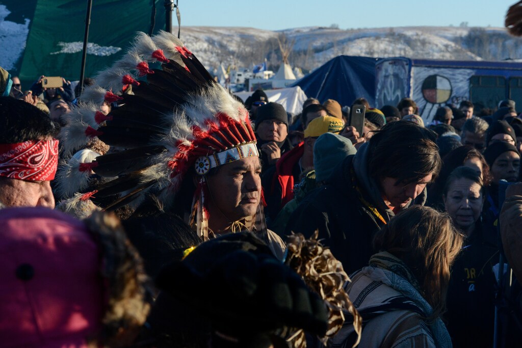 People celebrate in Oceti Sakowin camp as "water protectors" continue to demonstrate against plans to pass the Dakota Access pipeline near the Standing Rock Indian Reservation, near Cannon Ball, North Dakota, U.S. December 4, 2016. REUTERS/Stephanie Keith - RTSUMYP