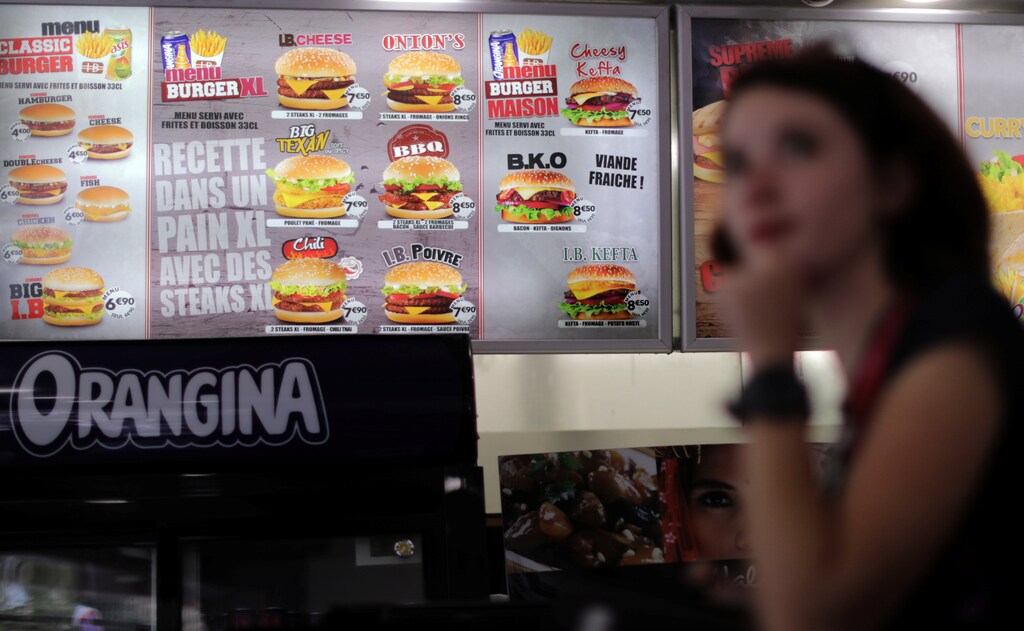 A customer waits to order food at the Isla Burger Halal fast-food in Nice, France, September 25, 2017. REUTERS/Eric Gaillard - RC1ECE2AE220