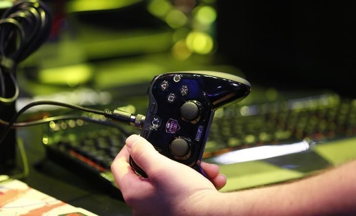 A video game controller is seen at the Gamescom 2014 fair in Cologne August 13, 2014. The Gamescom convention, Europe's largest video games trade fair, runs from August 13 to August 17. REUTERS/Ina Fassbender (GERMANY - Tags: ENTERTAINMENT SOCIETY BUSINESS)