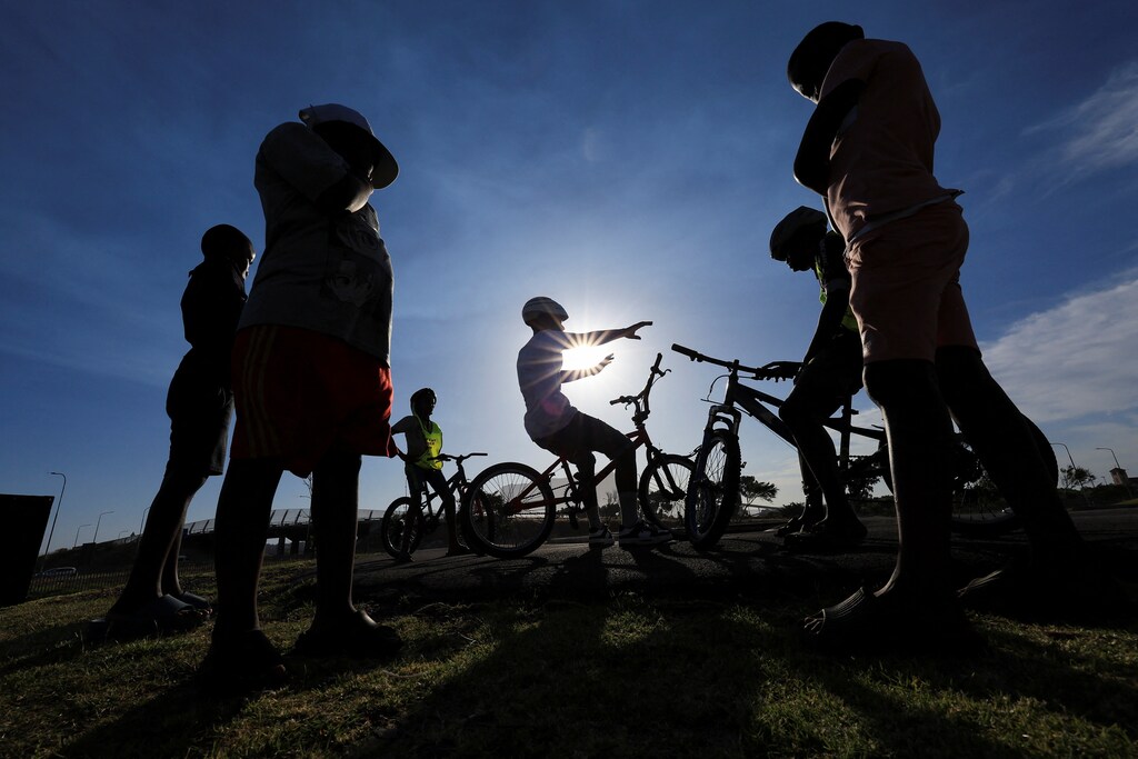 Riders gather at the Langa Bicycle Hub for their awareness ride through the streets of Langa township, in Cape Town, South Africa, November 7, 2025, representing youth voice.