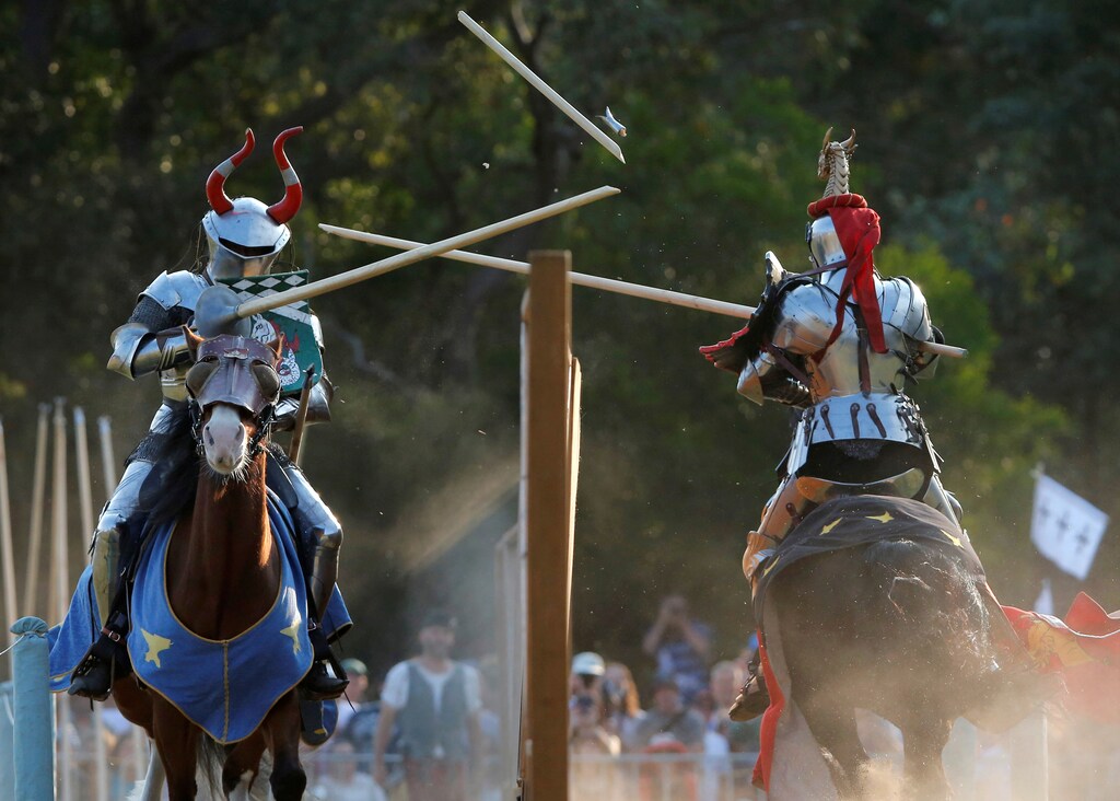 Norwegian jouster Per Estein Prois-Rohjell (L) competes with Australian jouster Phillip Leitch during the inaugural World Jousting Championship at the St Ives Medieval Faire in Sydney, Australia, September 24, 2017. REUTERS/Jason Reed - RC1973B59610