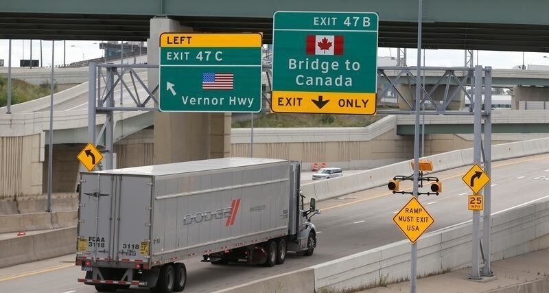 A commercial truck exits the highway for the Ambassador Bridge to Canada, in Detroit, Michigan U.S. August 30, 2018.