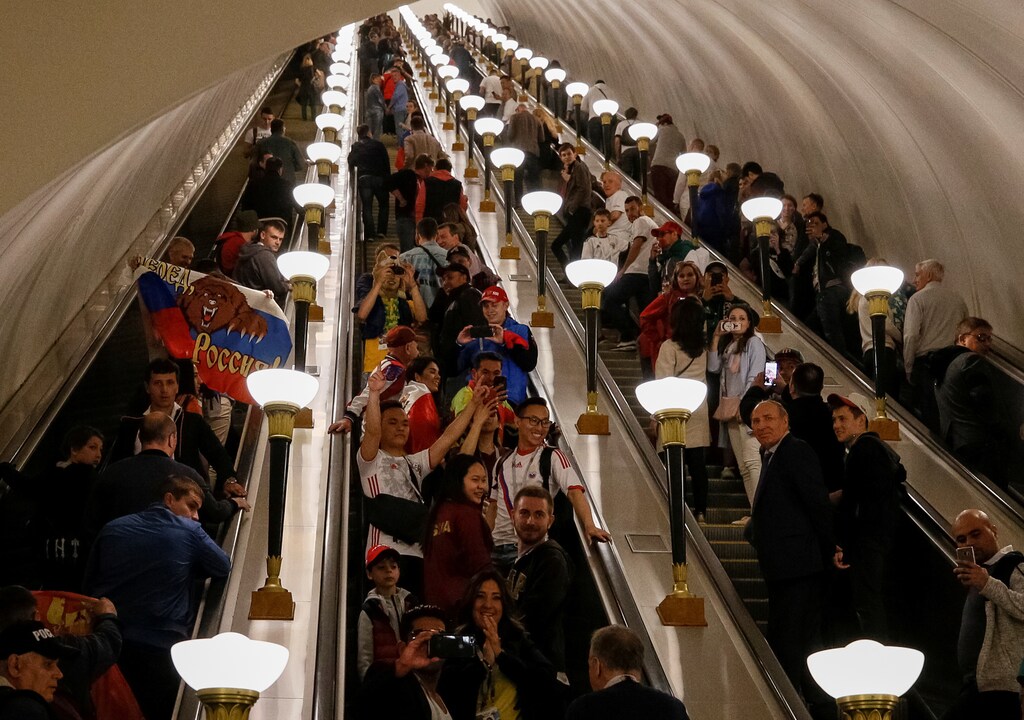 Soccers fans are seen at the escalator at a subway station on the first day of the 2018 FIFA World Cup in Moscow, Russia, June 14, 2018. REUTERS/Gleb Garanich - RC11BB740260