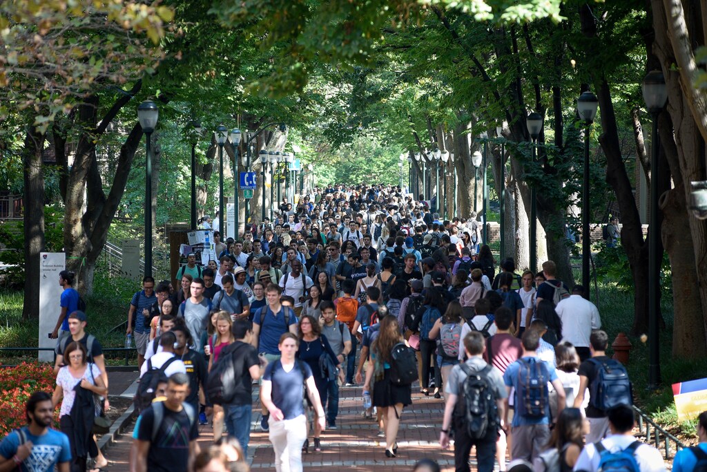 Students walk between classes on the Locust Walk on the campus of the University of Pennsylvania in Philadelphia, Pennsylvania, U.S., September 25, 2017. REUTERS/Charles Mostoller - RC186F916F50