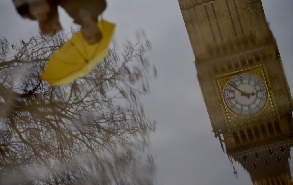 The Big Ben clocktower is reflected in a puddle London, Britain, 12 March, 2017. REUTERS/Hannah McKay TPX IMAGES OF THE DAY - RTX30P33