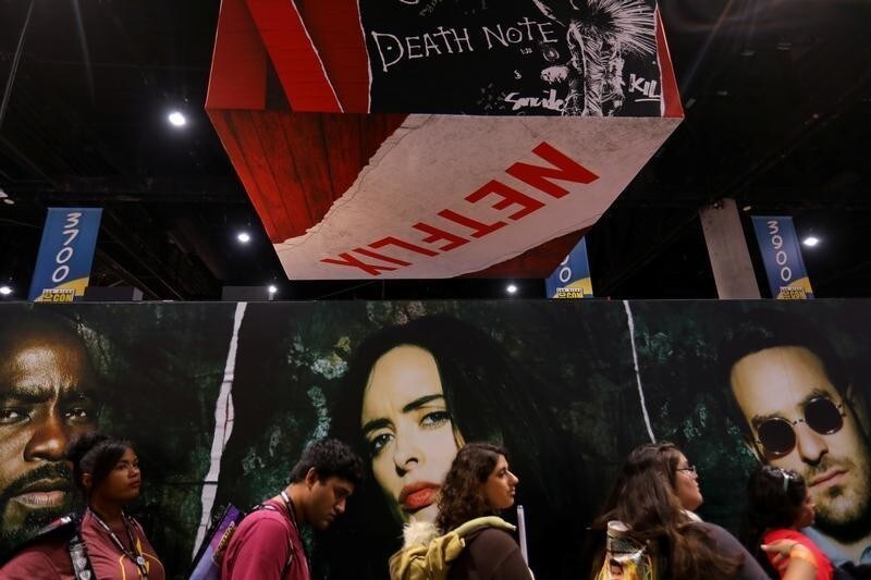 Attendees wait in line to enter the Netflix booth at Comic Con International in San Diego, California, U.S., July 21, 2017.