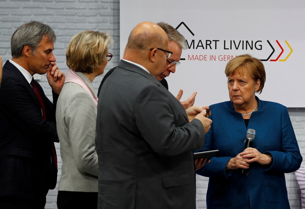 German Chancellor Angela Merkel attends the government's Digital Summit to unveil her government's artificial intelligence strategy at the fairground in Nuremberg, Germany, December 4, 2018. REUTERS/Kai Pfaffenbach - RC1E5E301330