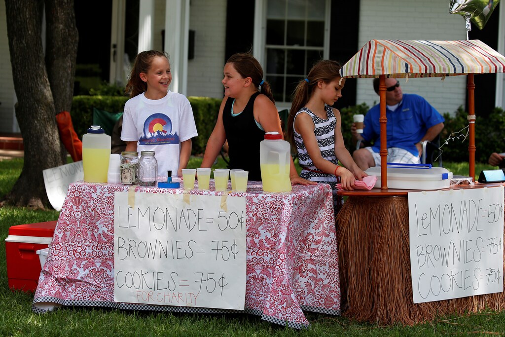 Children in Dallas operate a charity lemonade stand.