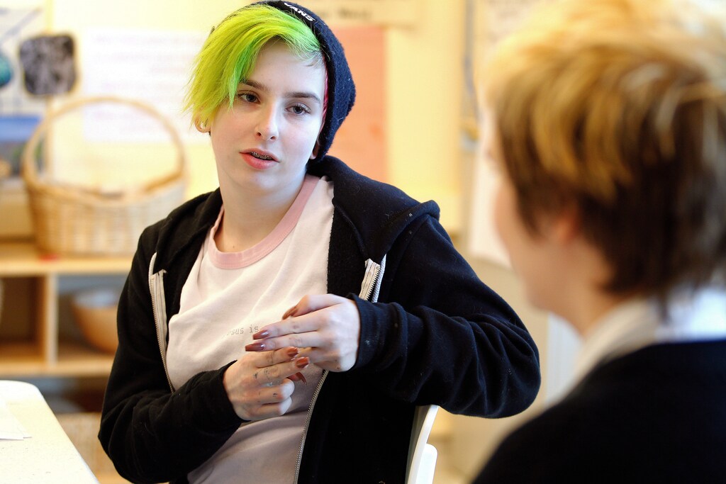Students Josh Farabee (L), and Rowan Brothers (R), work on signing during sign language class at the Pride School in Atlanta, Georgia, U.S. on December 7, 2016. The Pride School is a K-12 school for LGBT+ students and others that benefit from alternative educational resources. Picture taken on December 7, 2016. REUTERS/Tami Chappell - RTX2VNUS